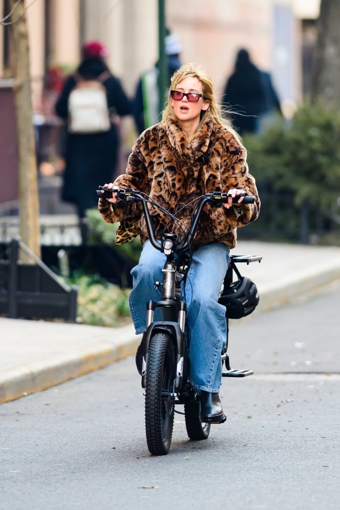 Jennifer Lawrence riding a bicycle in New York