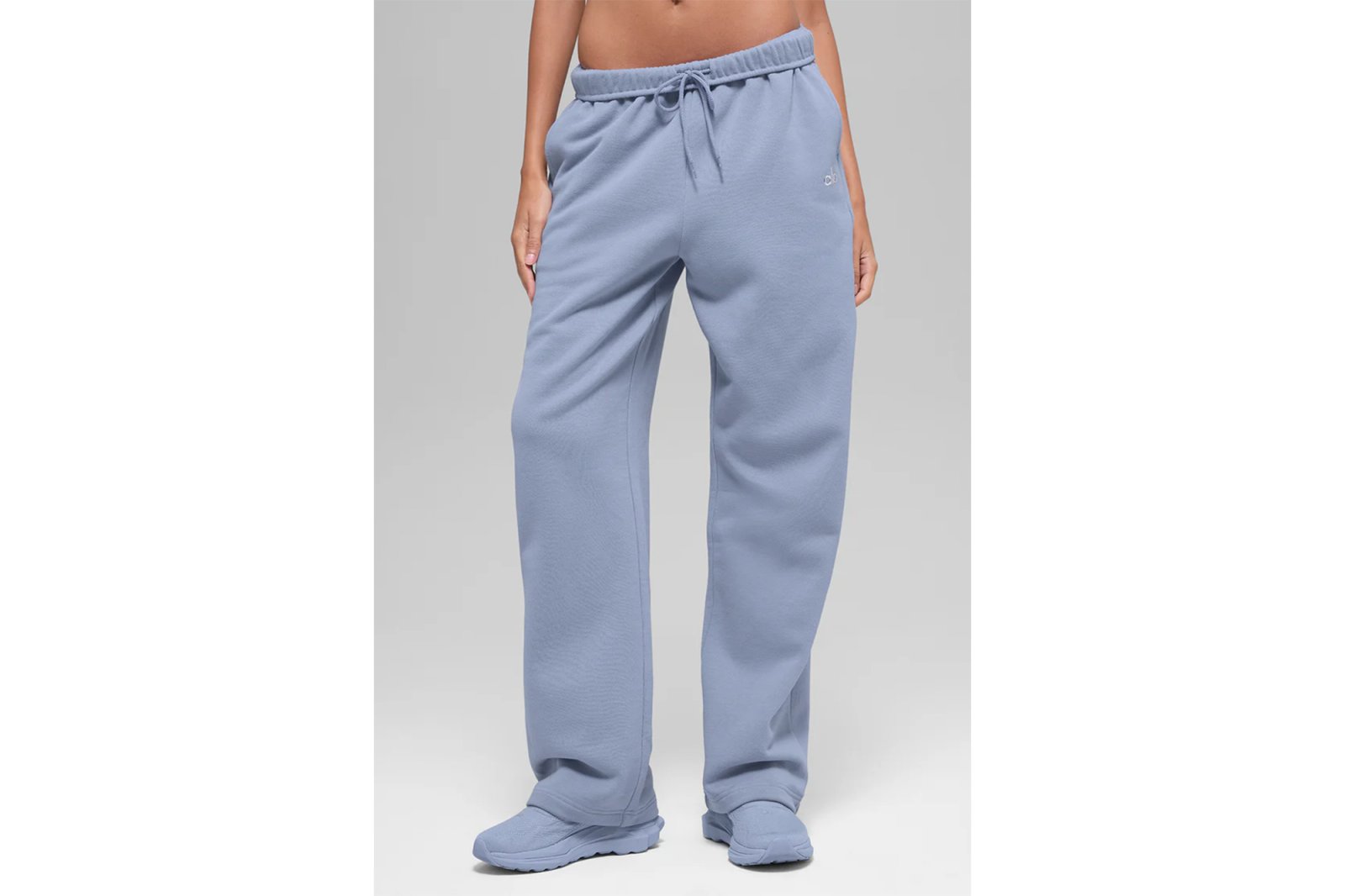 Light blue sweatpants with elastic waist and drawstring.