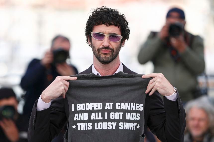 Jordan Firstman, making his directorial debut this year, arrived wearing a daring slogan t-shirt.