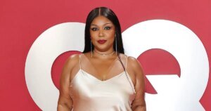 Lizzo Celebrates Body Positivity in Stunning Red Lingerie Under a Sheer Lace Dress