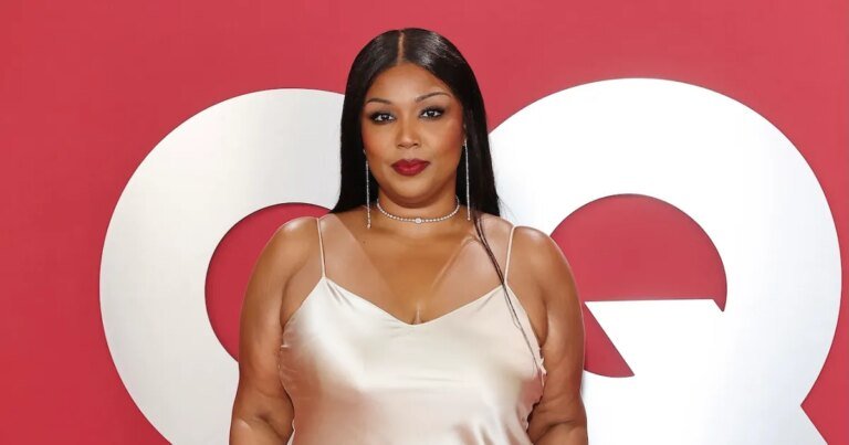 Lizzo Celebrates Body Positivity in Stunning Red Lingerie Under a Sheer Lace Dress