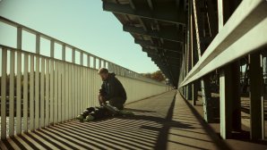 Daniel, the protagonist of ‘Closure,’ on a bridge in Warsaw overlooking the Vistula River